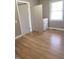 Bright laundry room with washer, dryer, and light wood flooring at 327 Ranch Farm Rd, Raleigh, NC 27603