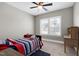 Bedroom with twin bed, desk, and window with plantation shutters at 5356 Cypress Ln, Raleigh, NC 27609