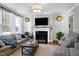 Living room with a fireplace and comfortable seating area at 5356 Cypress Ln, Raleigh, NC 27609
