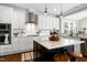 Kitchen features a large island, white cabinets, and stainless steel appliances at 5356 Cypress Ln, Raleigh, NC 27609