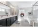 Main bathroom with double vanity and large mirror at 5356 Cypress Ln, Raleigh, NC 27609