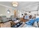 Open concept living room with a view into the kitchen at 5356 Cypress Ln, Raleigh, NC 27609