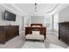 Main bedroom with a king-size bed, and ample natural light at 5356 Cypress Ln, Raleigh, NC 27609