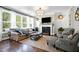 Living room with a fireplace and comfortable seating area at 5356 Cypress Ln, Raleigh, NC 27609