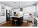 Island kitchen with stainless steel appliances and white cabinets at 5356 Cypress Ln, Raleigh, NC 27609