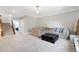 Comfortable sitting area with sectional sofa and ottoman, near staircase at 5356 Cypress Ln, Raleigh, NC 27609