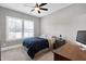 Bright bedroom with a queen bed, desk, and window at 5356 Cypress Ln, Raleigh, NC 27609