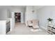 Hallway with seating area, closet and view of the stairs at 5356 Cypress Ln, Raleigh, NC 27609