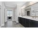 Main bathroom with double vanity and large mirror at 5356 Cypress Ln, Raleigh, NC 27609