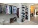 Large walk-in closet with hanging rods, shelving, and shoe storage at 5356 Cypress Ln, Raleigh, NC 27609