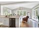 Sunroom features hardwood floors, a chandelier, and ample natural light at 5356 Cypress Ln, Raleigh, NC 27609