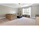 Cozy sitting area with sectional sofa and ottoman at 5356 Cypress Ln, Raleigh, NC 27609