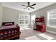 Bright bedroom with a twin-sized bed, desk, and ample natural light at 5356 Cypress Ln, Raleigh, NC 27609