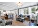 Open living room with hardwood floors and views into the kitchen at 5356 Cypress Ln, Raleigh, NC 27609