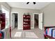 Well-lit bedroom with twin bed, built-in shelves and closet at 5356 Cypress Ln, Raleigh, NC 27609
