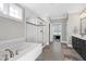 Main bathroom with soaking tub, walk-in shower, and double vanity at 5356 Cypress Ln, Raleigh, NC 27609