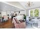 Sunroom with hardwood floors, comfortable seating and views of backyard at 5356 Cypress Ln, Raleigh, NC 27609