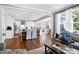 Open concept kitchen with white cabinets and an island at 5356 Cypress Ln, Raleigh, NC 27609