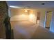 Large basement room with carpet and multiple doors at 316 Edgewater Dr, Broadway, NC 27505