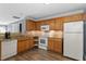 Kitchen with wood cabinets, granite counters and appliances at 2633 Vega Ct, Raleigh, NC 27614