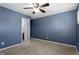 Bright bedroom featuring ceiling fan and access to bathroom at 2633 Vega Ct, Raleigh, NC 27614