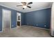 Spacious bedroom with ceiling fan and walk-in closet at 2633 Vega Ct, Raleigh, NC 27614
