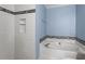 Bathroom with soaking tub and shower alcove at 2633 Vega Ct, Raleigh, NC 27614