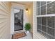 Townhome entrance with glass front door, window, and welcome mat at 2633 Vega Ct, Raleigh, NC 27614
