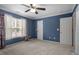 Bright bedroom with large window, ceiling fan and closet at 2633 Vega Ct, Raleigh, NC 27614