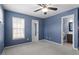 Spacious bedroom with ceiling fan and en-suite bathroom access at 2633 Vega Ct, Raleigh, NC 27614