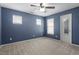 Bedroom with neutral walls, carpet, and ceiling fan at 2633 Vega Ct, Raleigh, NC 27614