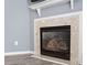 Gas fireplace with marble surround in living room at 2633 Vega Ct, Raleigh, NC 27614