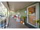Side view of a front porch with rocking chairs and autumnal decorations at 7925 S Highway 55, Willow Springs, NC 27592