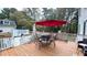 Deck with patio furniture and red umbrella at 159 Trantham Trl, Clayton, NC 27527