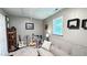 Cozy bedroom with a futon and window at 159 Trantham Trl, Clayton, NC 27527