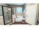 Bathroom with a soaking tub and walk-in shower at 159 Trantham Trl, Clayton, NC 27527