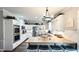 Bright kitchen with white cabinets, stainless steel appliances, and butcher block island at 159 Trantham Trl, Clayton, NC 27527