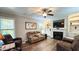 Relaxing living room with fireplace, built-in shelving, and hardwood floors at 159 Trantham Trl, Clayton, NC 27527