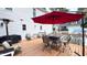 Deck features patio furniture, umbrella, and grill at 159 Trantham Trl, Clayton, NC 27527