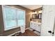 Bathroom with double vanity and large window at 159 Trantham Trl, Clayton, NC 27527