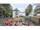 Private backyard with patio, fire pit, and wooded backdrop at 159 Trantham Trl, Clayton, NC 27527