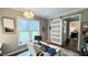 Bright home office features a built-in desk and sliding barn door at 159 Trantham Trl, Clayton, NC 27527