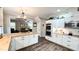 Open concept kitchen with white cabinets, stainless steel appliances and a large island at 159 Trantham Trl, Clayton, NC 27527