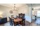 Formal dining room featuring hardwood floors, a large table, and a chandelier at 159 Trantham Trl, Clayton, NC 27527