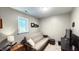 Versatile bonus room with a sofa and TV at 159 Trantham Trl, Clayton, NC 27527