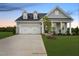 Gray two-story house with a two car garage and front porch at 53 Macy Cir, Wendell, NC 27591