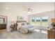 Spacious primary bedroom with large windows and en-suite bathroom at 53 Macy Cir, Wendell, NC 27591
