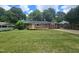 Brick ranch home with solar panels, ramp, and a spacious lawn at 805 Newcombe Rd, Raleigh, NC 27610
