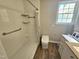 Updated bathroom with walk-in shower and modern fixtures at 805 Newcombe Rd, Raleigh, NC 27610
