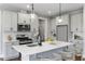 Modern kitchen with stainless steel appliances and large island at 71 Macy Cir, Wendell, NC 27591